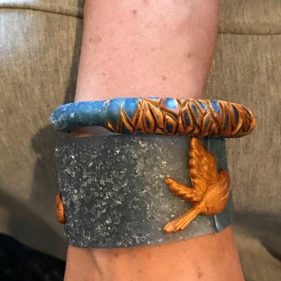 Matana chasing a feather Bird bangle in Denim - Picture 6 of 8